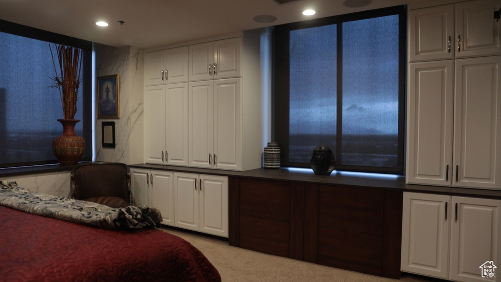 Bedroom featuring light colored carpet