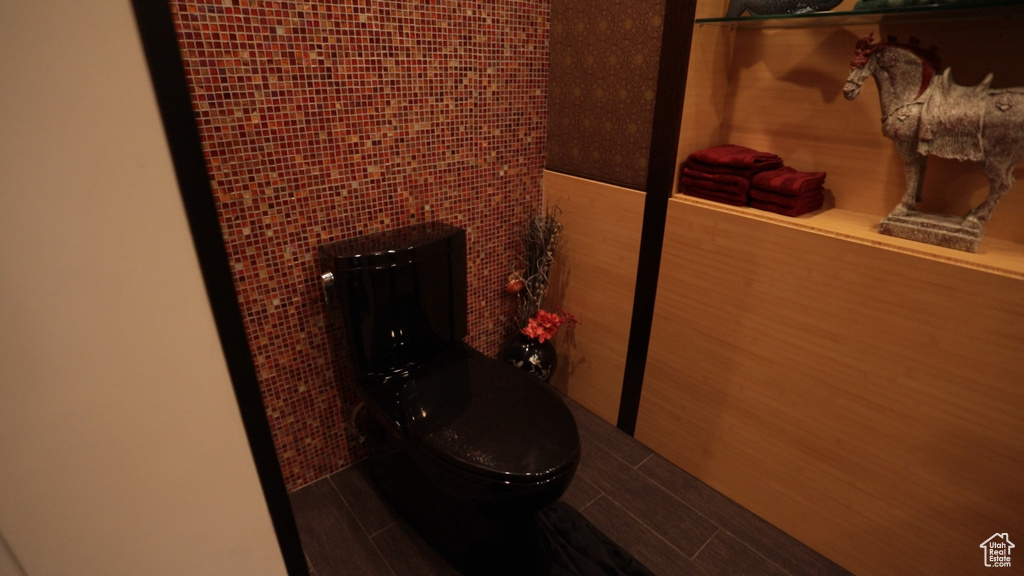 Bathroom with hardwood / wood-style floors and toilet