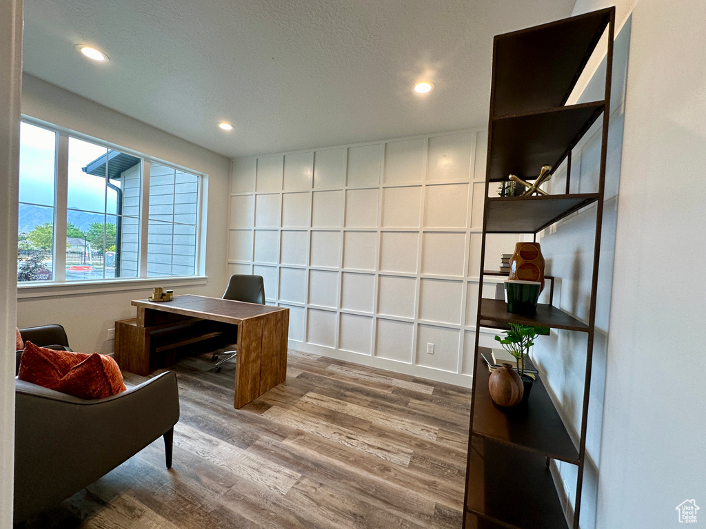 Office with hardwood / wood-style floors