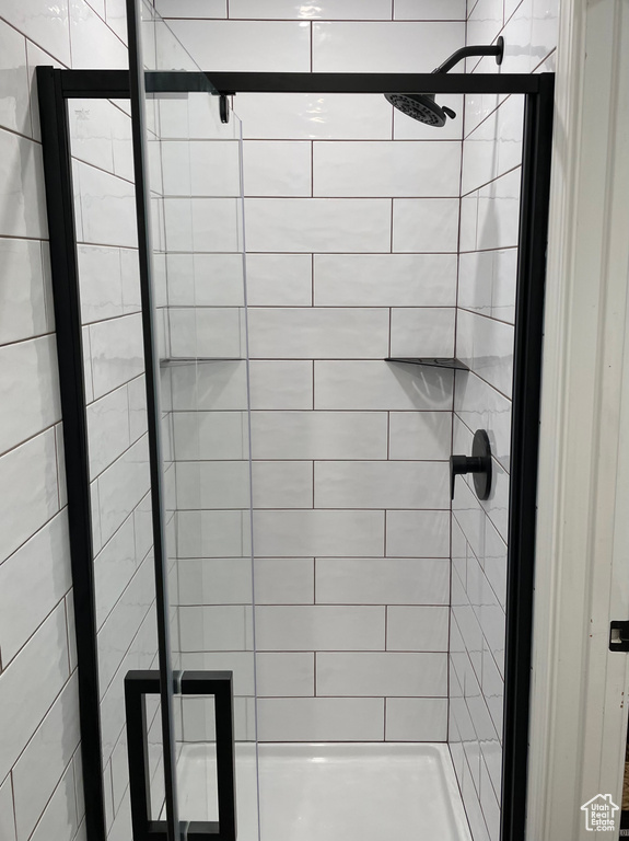 Bathroom with a shower with door