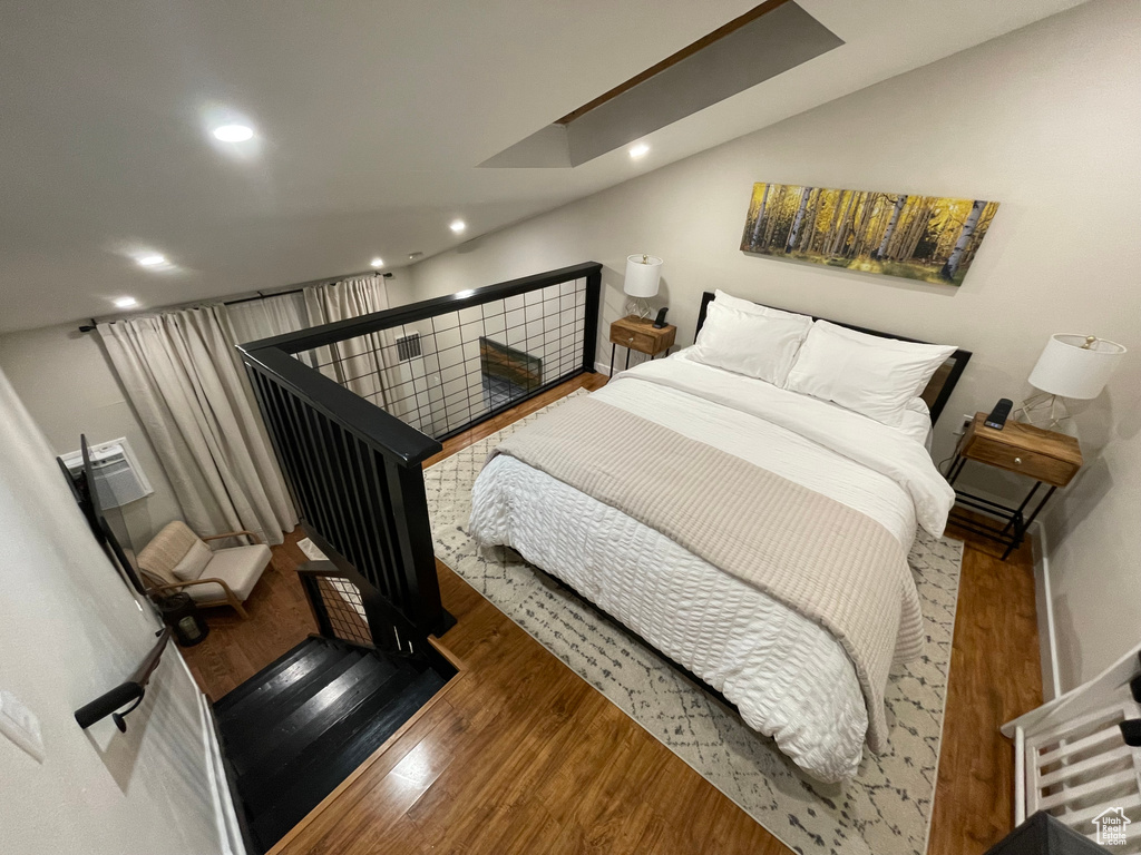 Bedroom with wood-type flooring