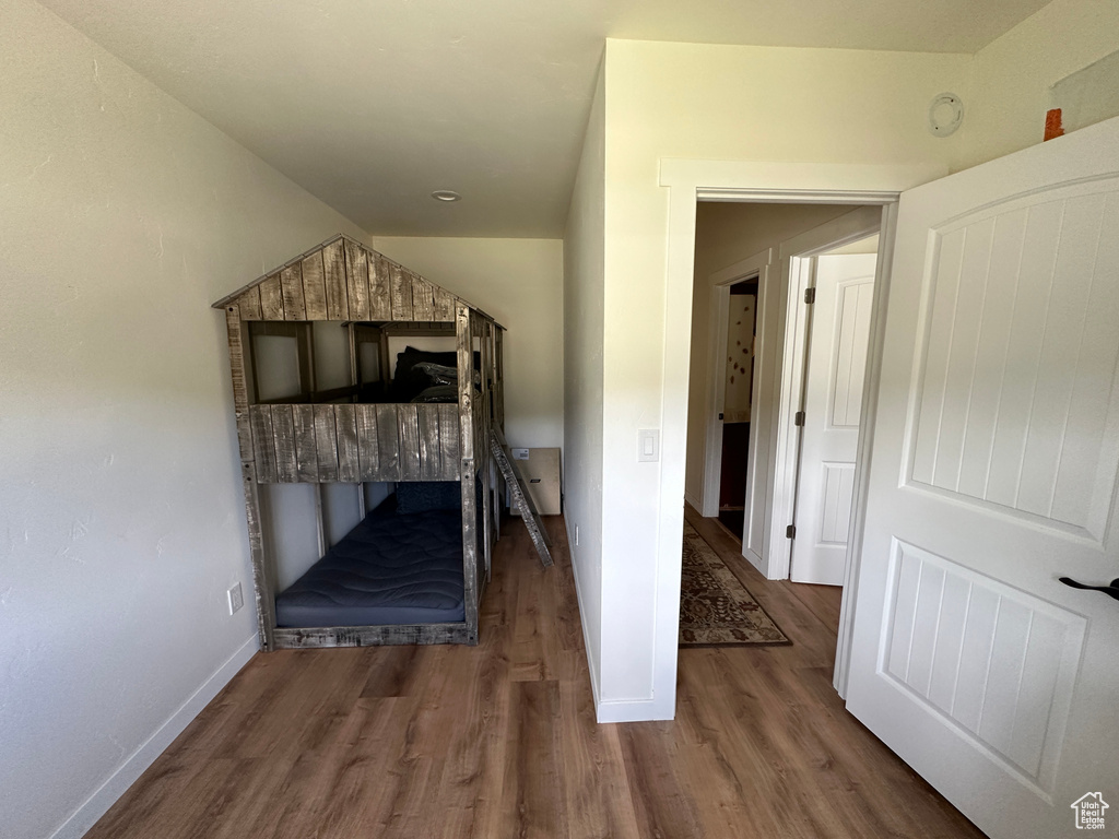 Unfurnished bedroom with hardwood / wood-style flooring