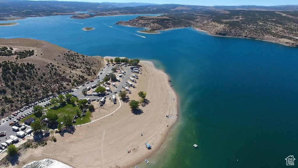 Birds eye view of property featuring a water view