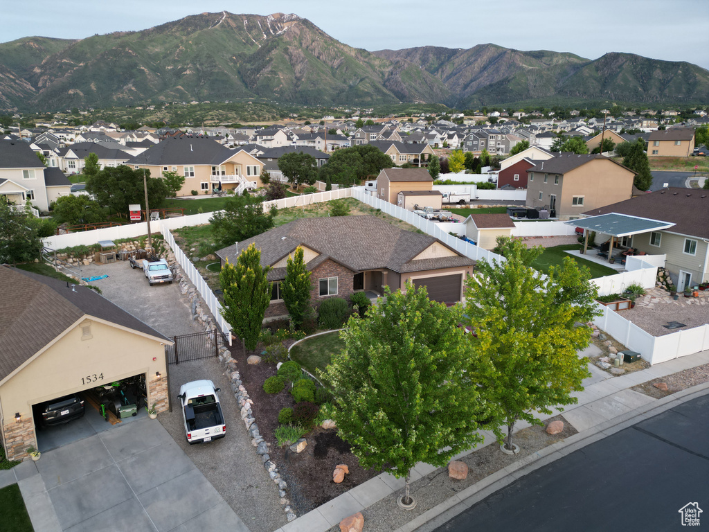 Birds eye view of property with a mountain view