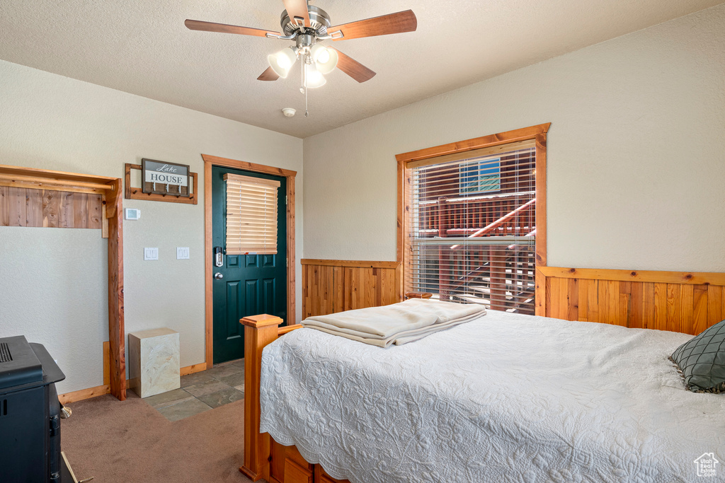 Bedroom featuring ceiling fan and carpet floors