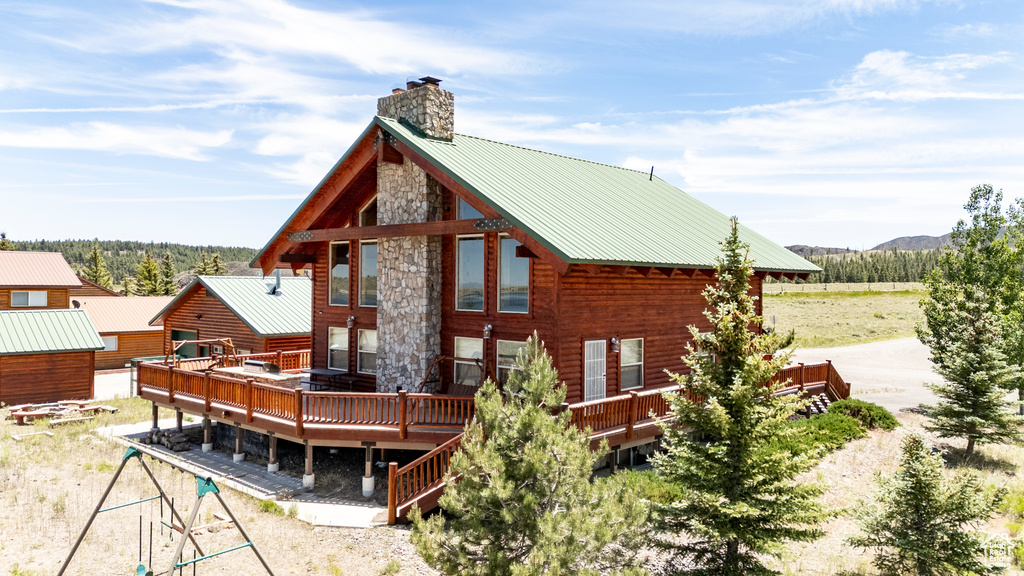 Rear view of property with a wooden deck