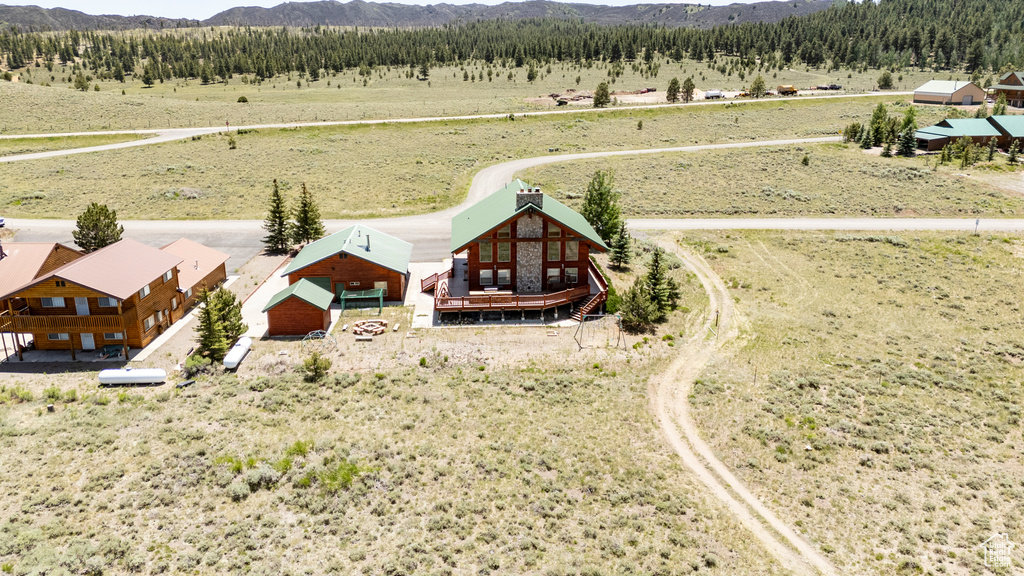 Birds eye view of property with a rural view