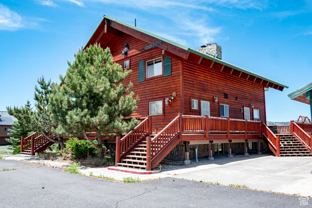 View of front facade featuring a deck