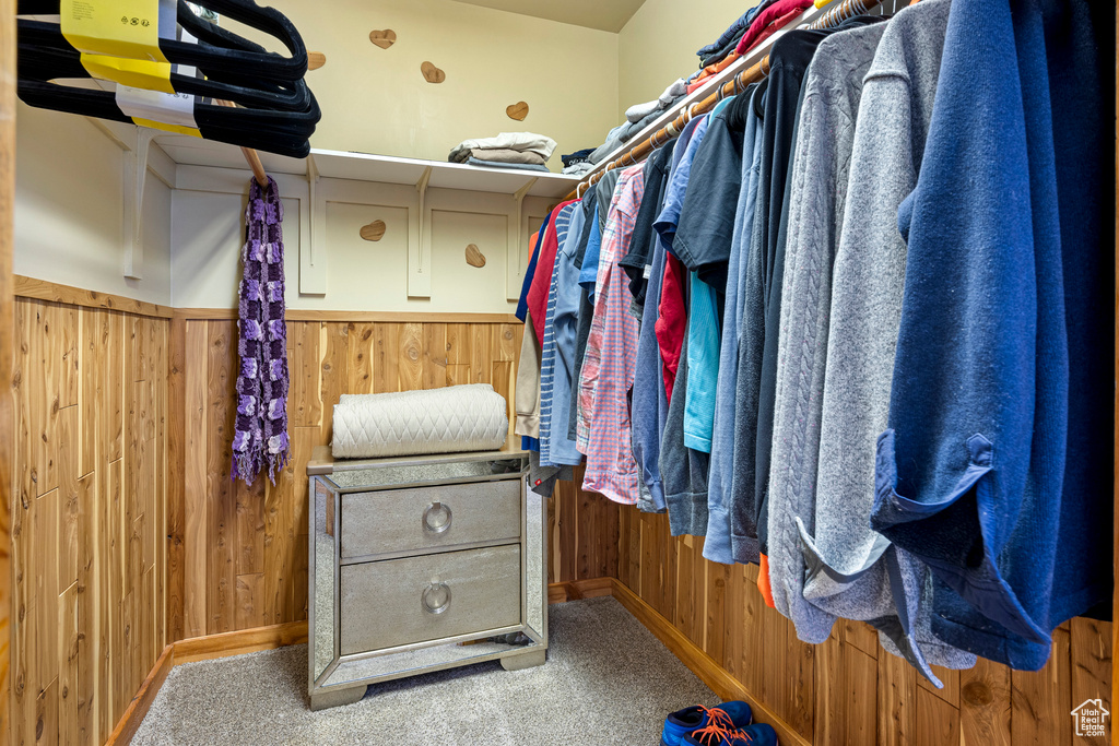 Walk in closet featuring carpet flooring