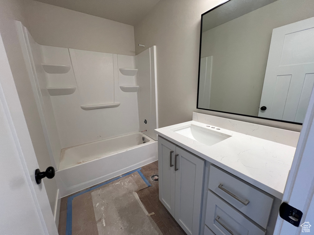 Bathroom with shower / bathtub combination and vanity