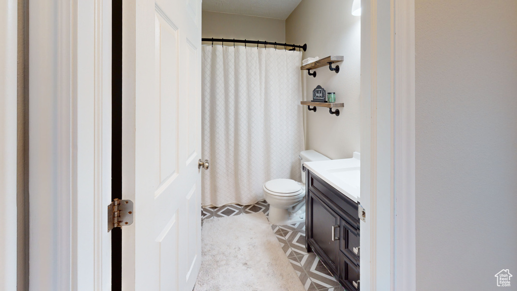 Bathroom with toilet and vanity