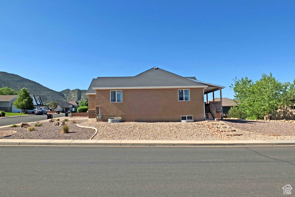 View of property exterior with a mountain view