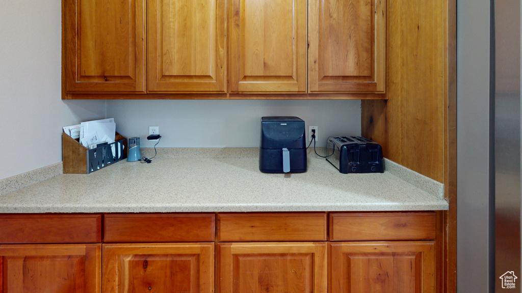 Kitchen featuring light stone countertops