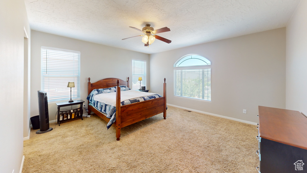 Bedroom with carpet flooring and ceiling fan