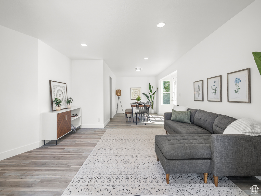 Living room with hardwood / wood-style flooring