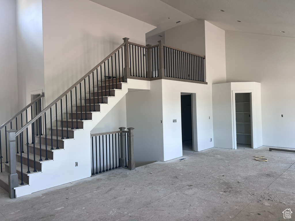 Stairway with a towering ceiling