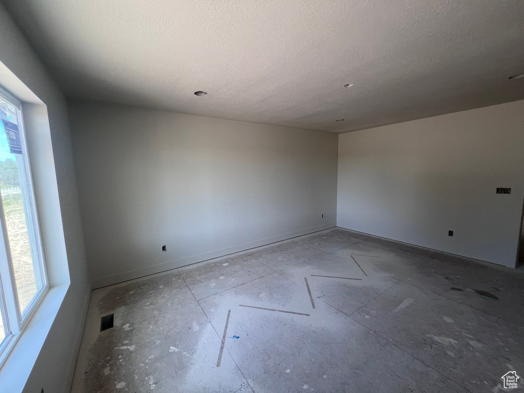 Spare room featuring a textured ceiling