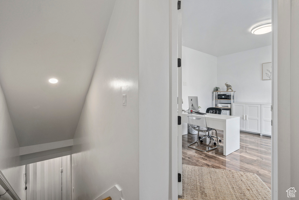 Hall with light hardwood / wood-style floors