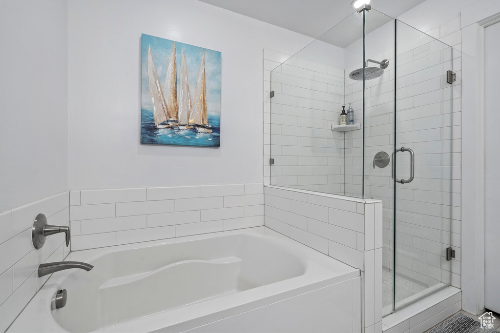 Bathroom featuring separate shower and tub