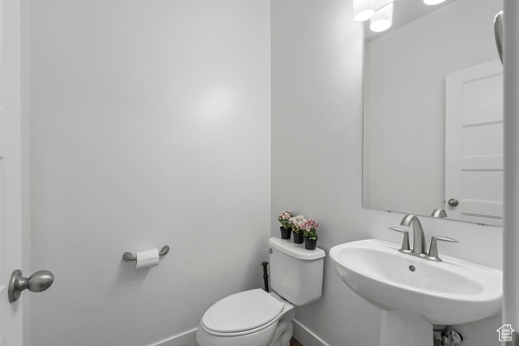 Bathroom featuring sink and toilet