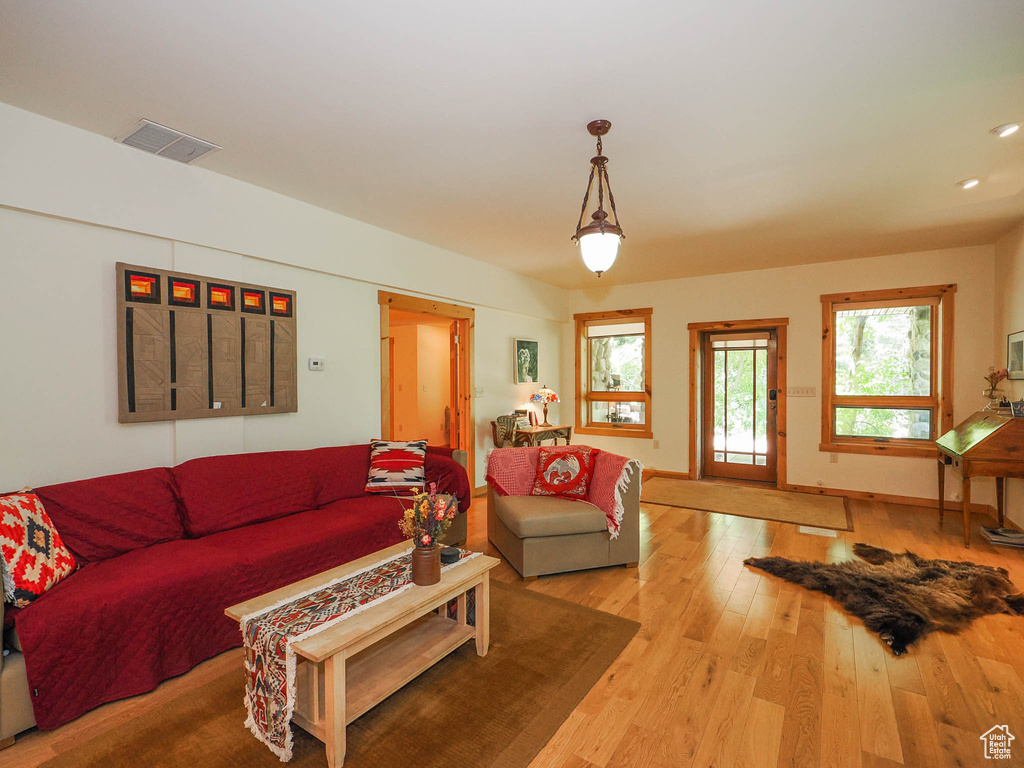 Living room with hardwood / wood-style flooring