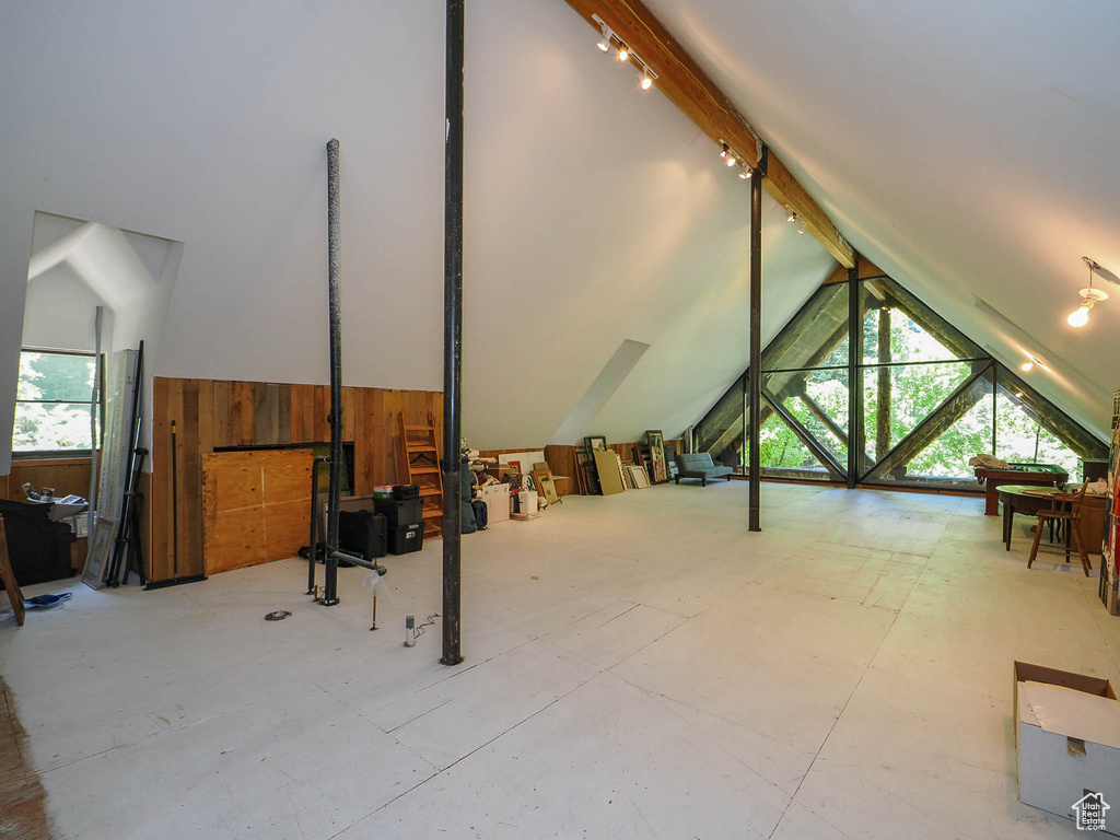 Bonus room with a healthy amount of sunlight and lofted ceiling