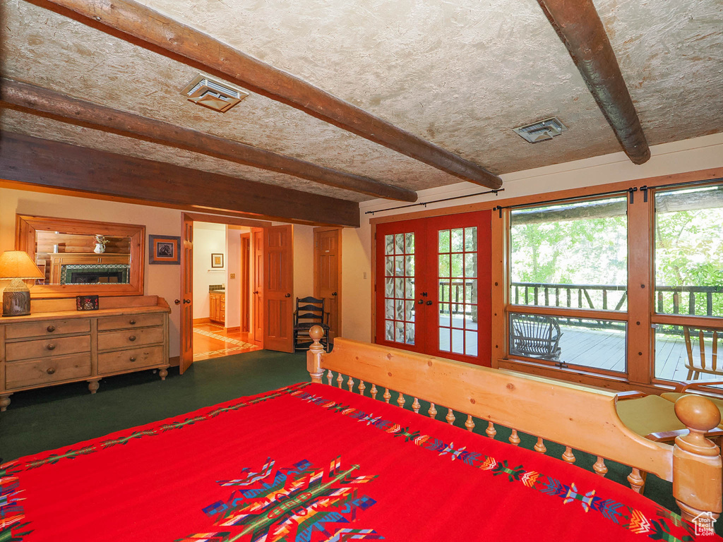 Interior space featuring beam ceiling and french doors