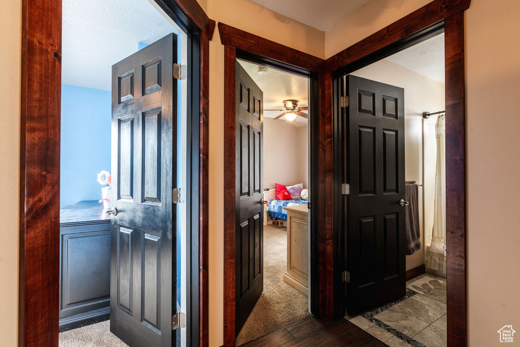 Hallway featuring carpet floors