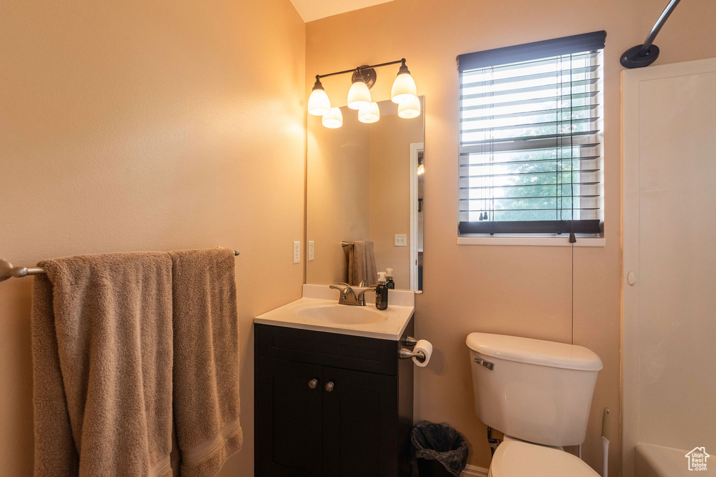 Bathroom with toilet and large vanity