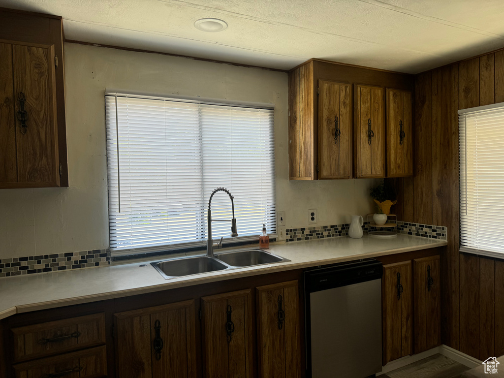 Kitchen with sink and stainless steel dishwasher