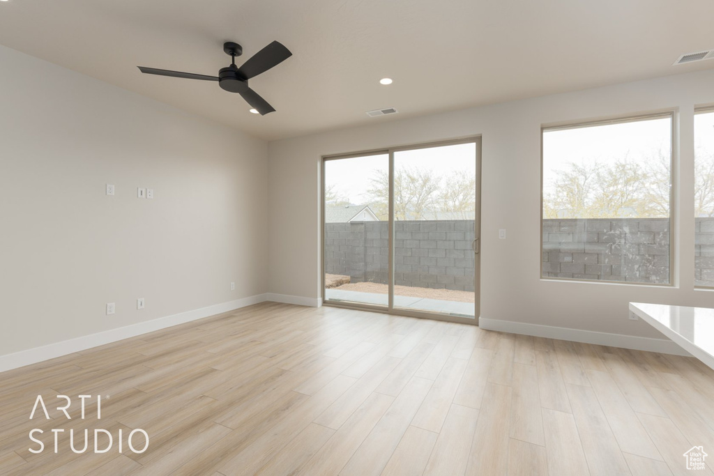 Unfurnished room with light wood-type flooring and ceiling fan