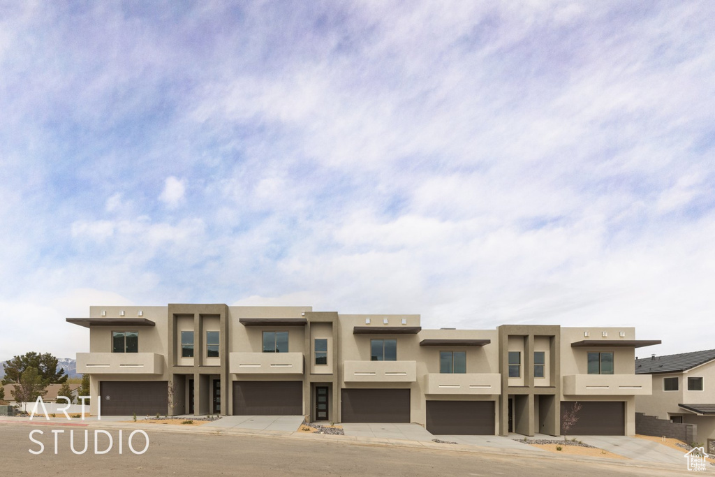 View of building exterior with a garage