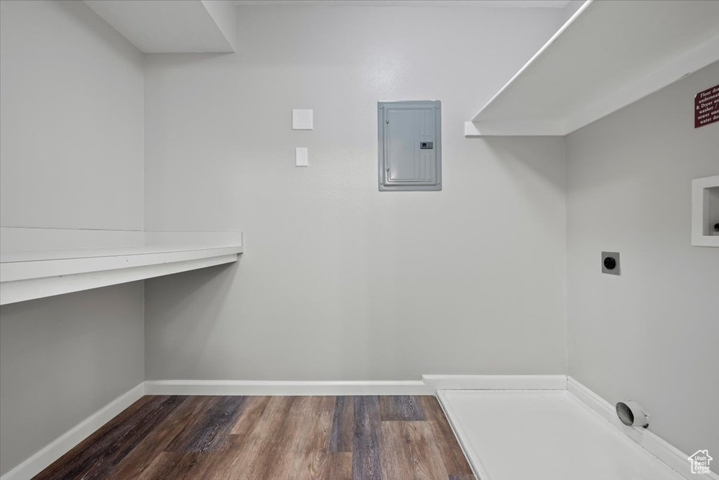 Laundry area with hookup for a washing machine, hardwood / wood-style floors, and hookup for an electric dryer