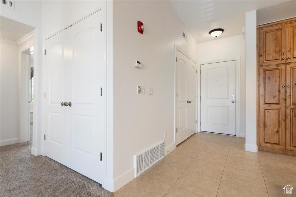 Hall with light tile flooring