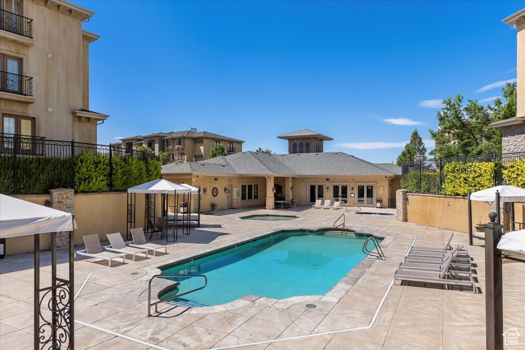 View of swimming pool featuring a patio