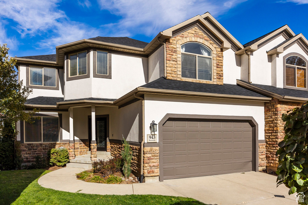 View of front of property with a garage