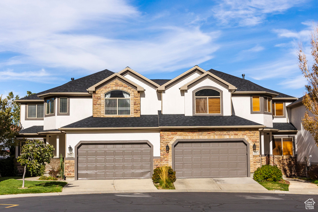 View of property with a garage