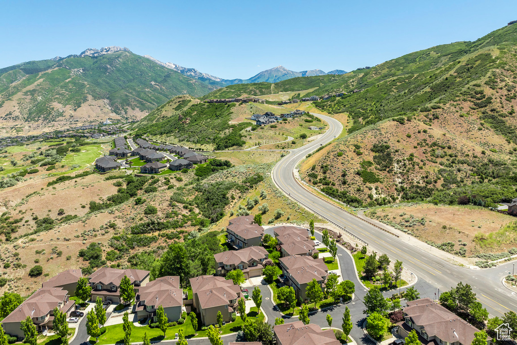 Birds eye view of property with a mountain view