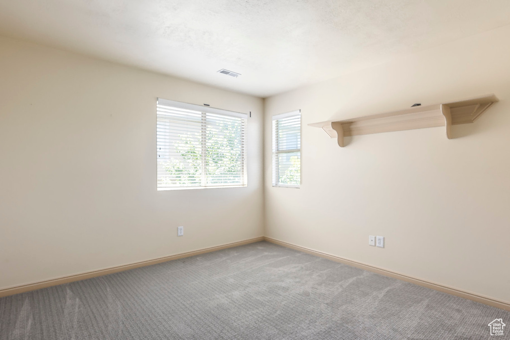 Unfurnished room featuring carpet flooring