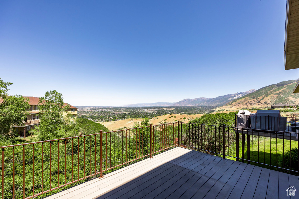 Wooden deck featuring a mountain view