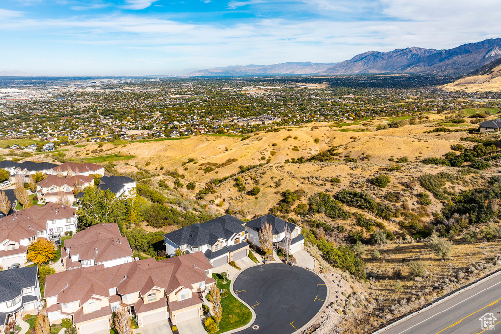 Birds eye view of property with a mountain view