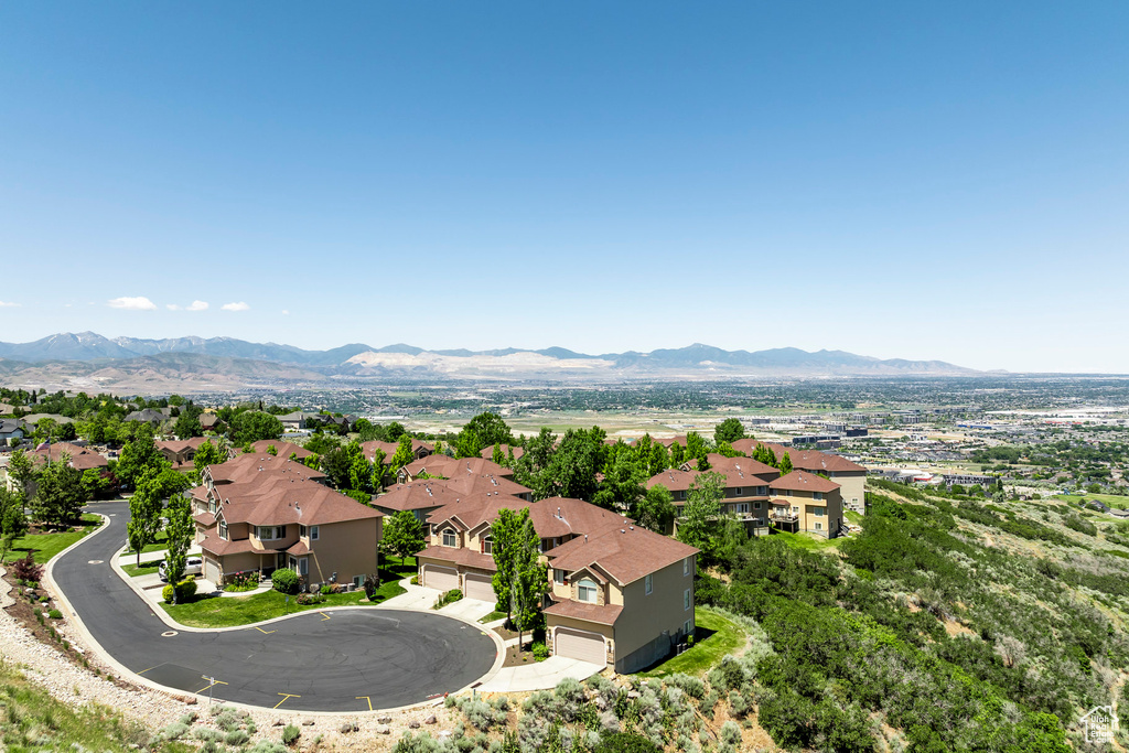 Birds eye view of property with a mountain view