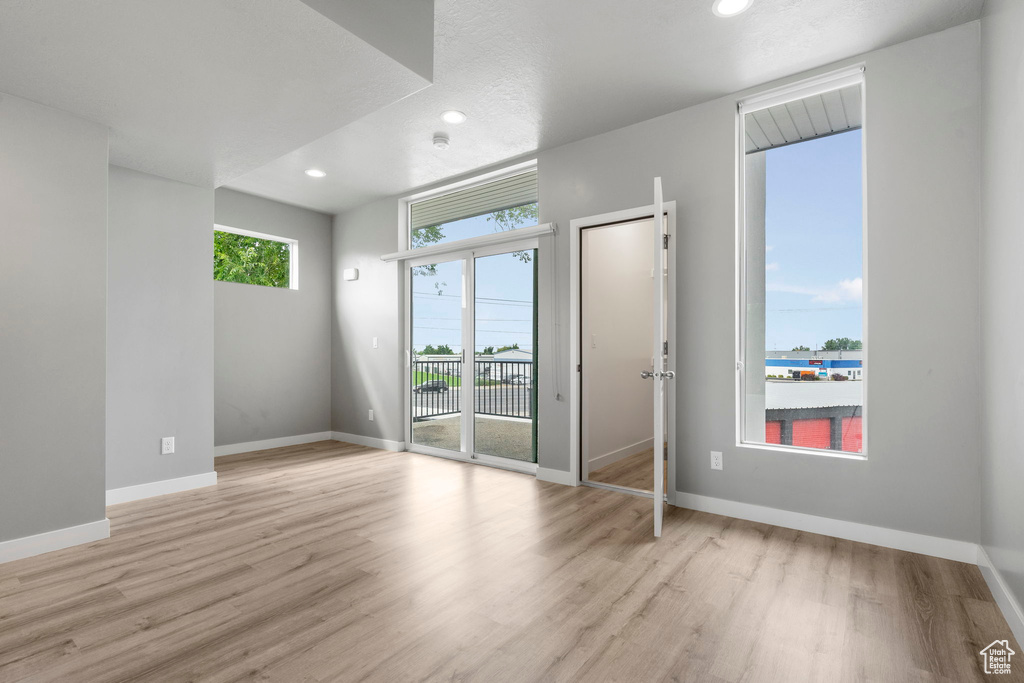 Spare room featuring light wood-type flooring