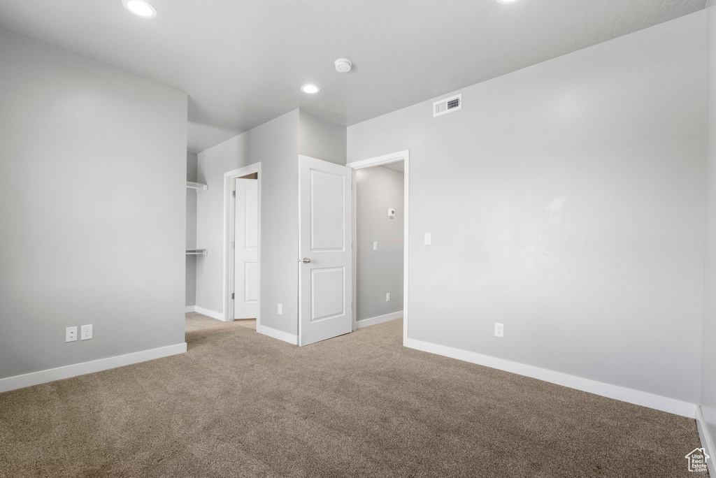 Unfurnished bedroom featuring carpet