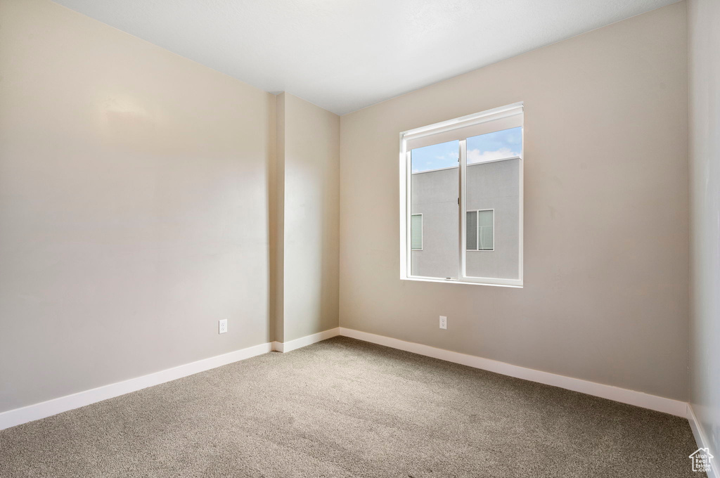 Empty room featuring carpet