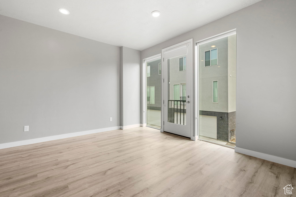 Spare room with light hardwood / wood-style flooring