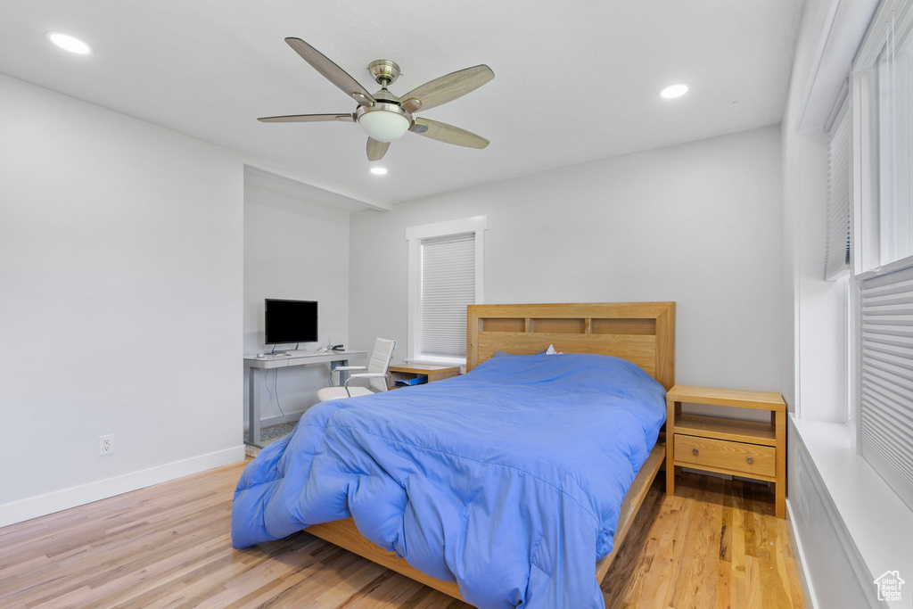 Bedroom with ceiling fan and light hardwood / wood-style floors