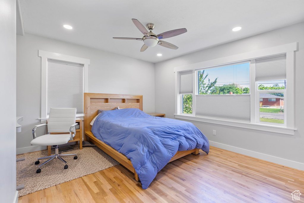 Bedroom featuring ceiling fan and light hardwood / wood-style flooring