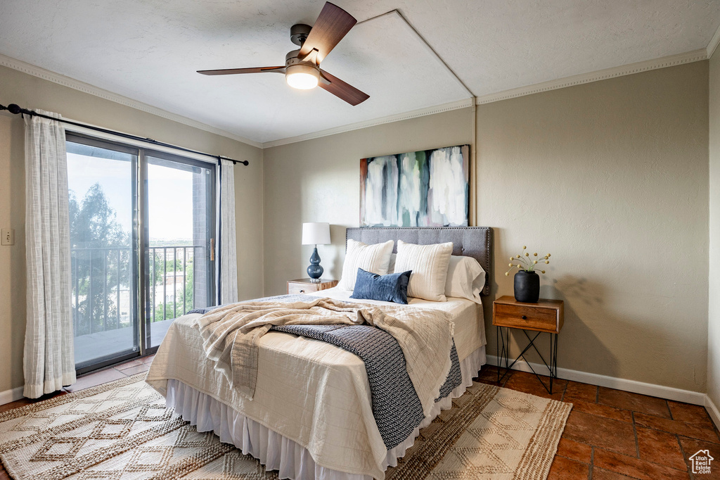 Tiled bedroom featuring access to outside, ornamental molding, multiple windows, and ceiling fan