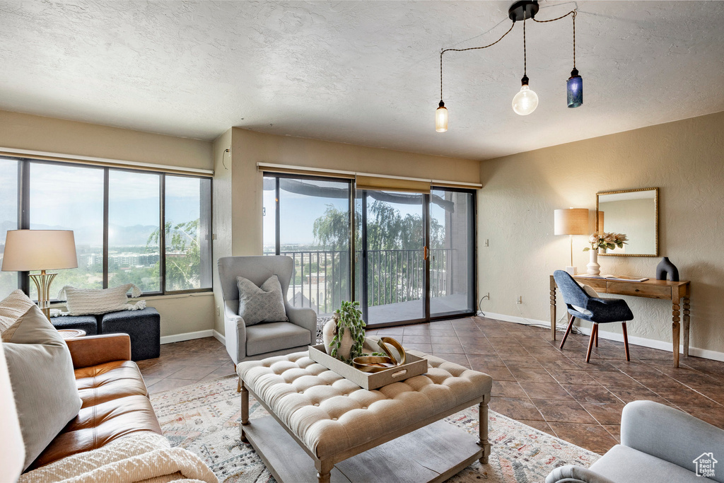 Tiled living room with a textured ceiling